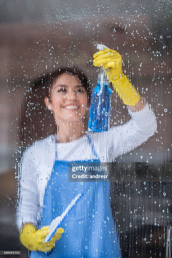 Woman cleaning windows