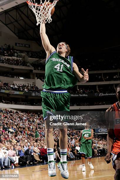 Dirk Nowitzki of the Dallas Mavericks goes for a layup against the Washington Wizards on January 18, 2005 at the American Airlines Center in Dallas,...