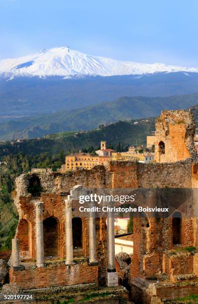 italy, sicily, taormina, the teatro greco (greek theatre) and mount etna (3346 m) - sicily italy stock pictures, royalty-free photos & images