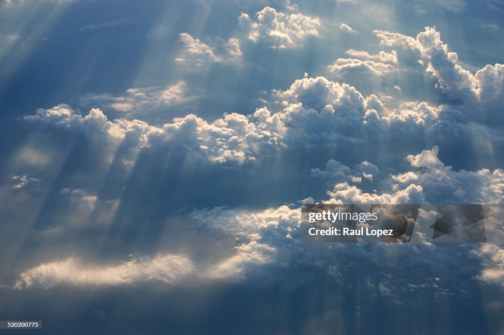 Ray of sunshine throug the clouds in blue sky