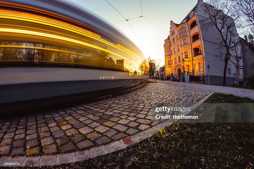 Tram in motion with yellow light stream