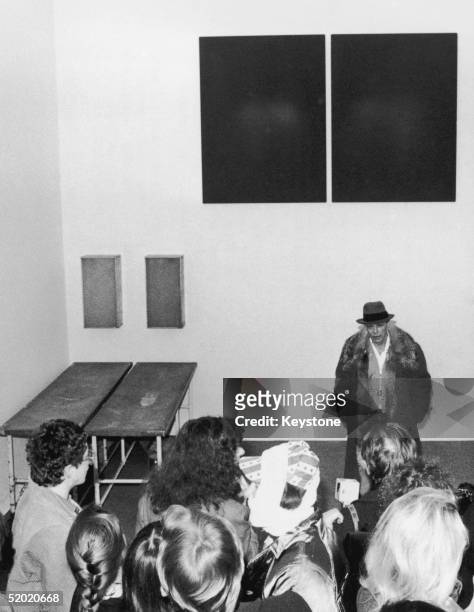 German artist Joseph Beuys introduces his installation 'Zeige Deine Wunde' at the Stadtische Gallerie Im Lenbachhaus, Munich, circa 1977.
