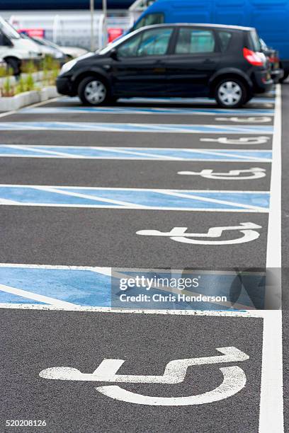 parking spaces for disabled drivers - handicap parking space stock pictures, royalty-free photos & images