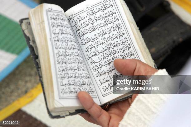 Muslim pilgrim recites the Koran at Mount Arafat, the scene of the Prophet Mohammed's last sermon 14 centuries ago, as the annual hajj pilgrimage...