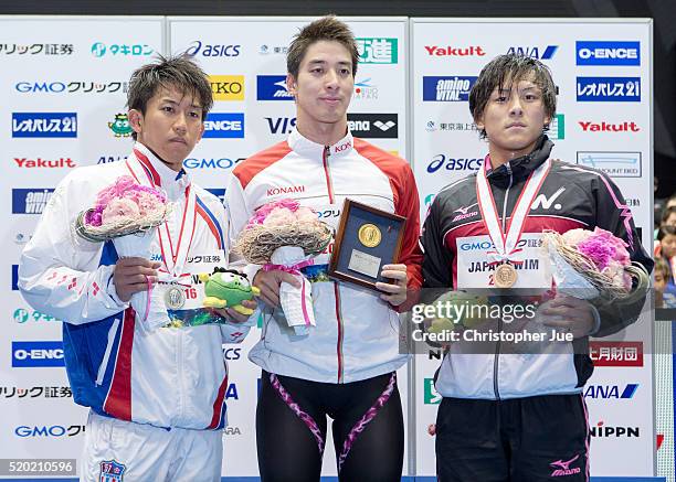 Takeshi Kawamoto , Takuro Fujii , and Takaya Yasue pose for photographs after the men's 100m butterfly final during the Japan Swim 2016 at Tokyo...