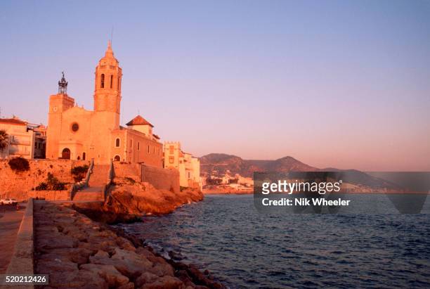 Late afternoon on the waterfront of Sitges, Costa Brava, Spain.