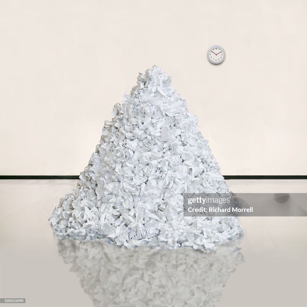 Pile of Crumpled Paper and Clock