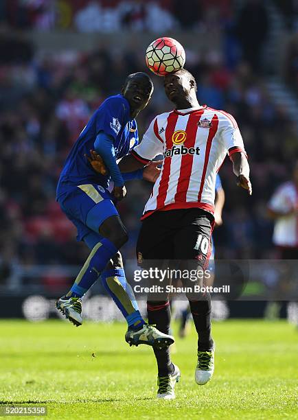 Ngolo Kante of Leicester City and Dame N'Doye of Sunderland jump for the ball during the Barclays Premier League match between Sunderland and...