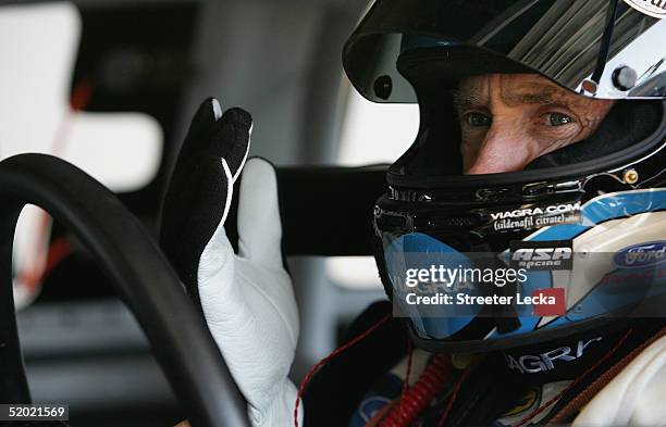 Mark Martin, driver of the Viagra Ford, dons his gloves during Nascar Nextel Cup testing, on January 19, 2005 at Daytona International Speedway in...