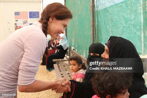 Actress and United Nations Population Fund's Goodwill Ambassador, Ashley Judd, chats with Syrian refugees during a visit at the Zaatari refugee camp,...