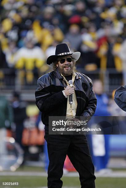 Hank Williams, Jr., leaves the field after singing the national anthem at the Pittsburgh Steelers and New York Jets AFC playoff game at Heinz Field...
