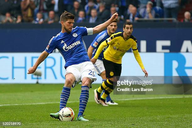 Klaas Jan Huntelaar of FC Schalke 04 scores his team's second goal from the penalty spot during the Bundesliga match between FC Schalke 04 and...