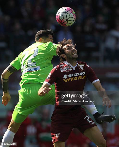 Emiliano Moretti of Torino FC competes for the ball with Marco Borriello of Atalanta BC during the Serie A match between Torino FC and Atalanta BC at...