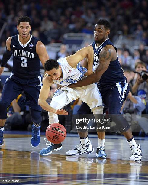 Marcus Paige of the North Carolina Tar Heels loses control of the ball against Darryl Reynolds of the Villanova Wildcats during the 2016 NCAA Men's...