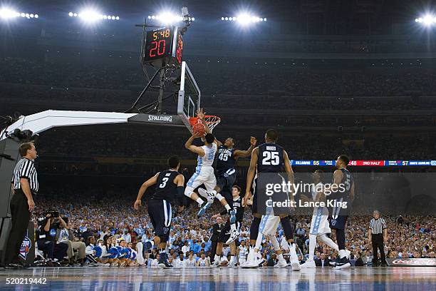 Marcus Paige of the North Carolina Tar Heels puts up a shot against Darryl Reynolds of the Villanova Wildcats during the 2016 NCAA Men's Final Four...