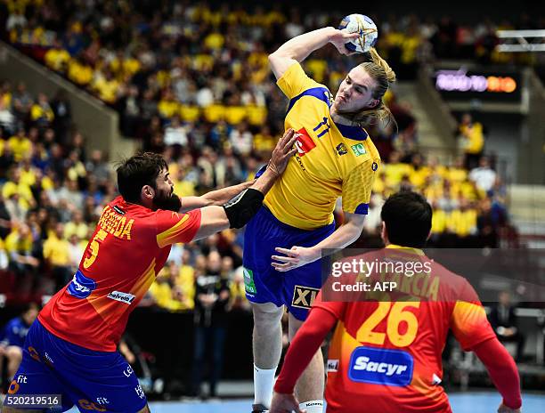 Spain's Jorge Maqueda stopps Sweden's Lukas Nilsson during men's handball Olympic Qualification Tournament group two between Sweden and Spain, on...