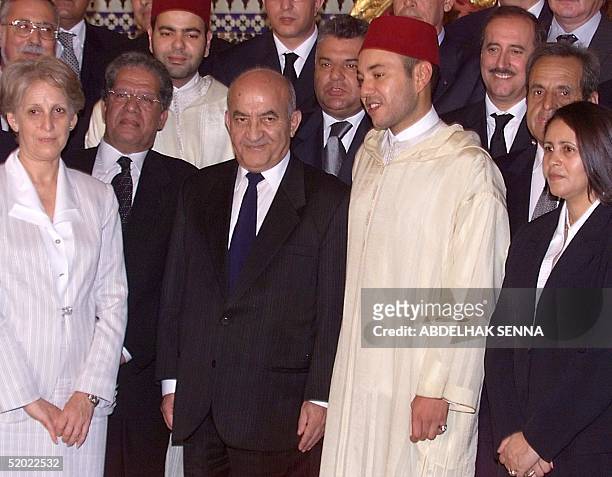 New King of Morocco Mohammed VI poses with Premier Abderrahmane Youssoufi on his left, and the only two female ministers, Aicha Belarbi minister for...