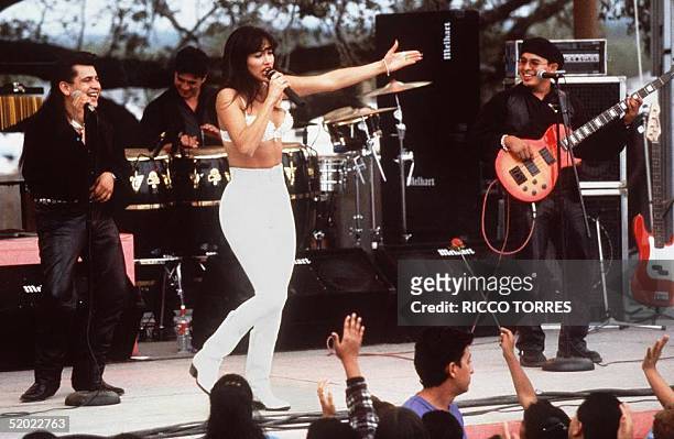 Actress Jennifer Lopez, who plays Selena in the movie "Selena," performs with her band in one of the scenes from the movie. "Selena" is about the...