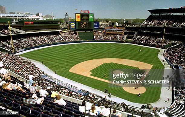 Workers on the field prepare the new Turner Field stadium for the first game to be played there, an exhibition game between the Atlanta Braves and...