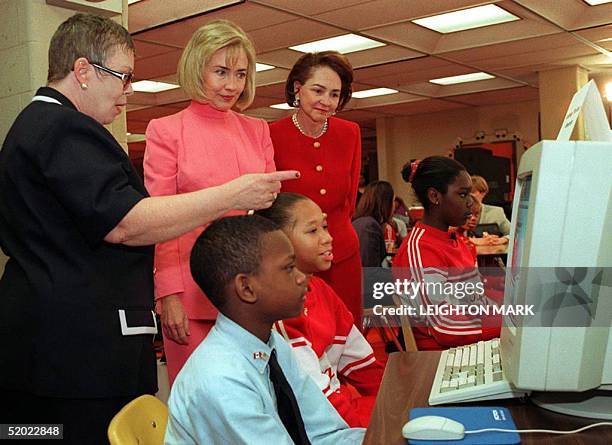 First Lady of the US Hillary Clinton and Aline Chretien of Canada are given a demonstration of Schoolnet by Linda Johnson, librarian and project...