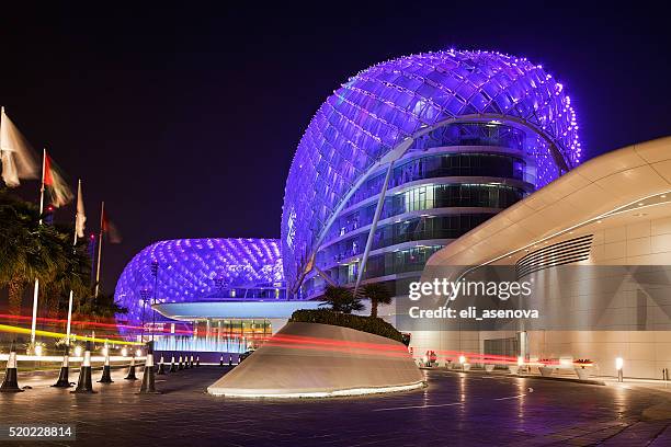 yas island viceroy hotel at night - abu dhabi night stock pictures, royalty-free photos & images