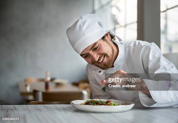 chef making a salad at a restaurant - chef happy stock pictures, royalty-free photos & images