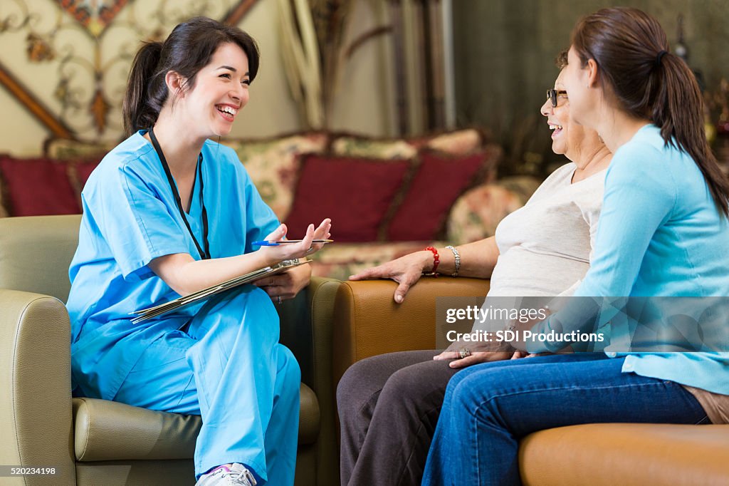 Home healthcare nurse visits with senior patient