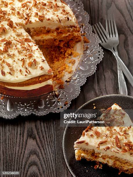 carrot cake with cream cheese icing - carrot cake stock pictures, royalty-free photos & images