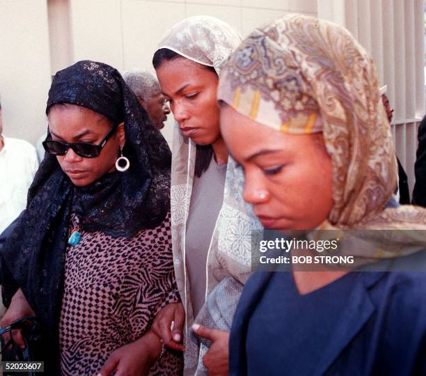 Three of the daughters of Betty Shabazz enter the Islamic Cultural Center in New York for private funeral services 27 June, 1997. Shabazz, the widow...