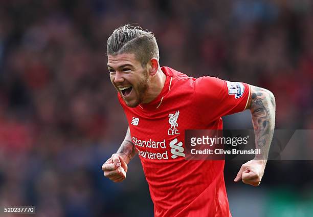 Alberto Moreno of Liverpool celebrates as he scores their first goal during the Barclays Premier League match between Liverpool and Stoke City at...