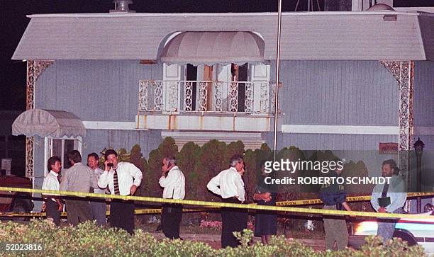 Miami Beach police and FBI agents surround a houseboat that was stormed by a police SWAT team on a canal in Miami Beach late 23 July. Police are...