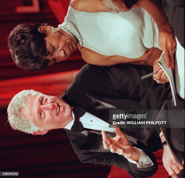 President Bill Clinton speaks with US Representative Maxine Waters at the Congressional Black Caucus' Gala in Washington DC 13 September.