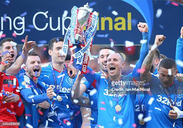 Kenny Miller of Rangers holds the trophy during the Petrofac Training Cup Final between Rangers and Peterhead at Hampden Park on April 10, 2016 in...