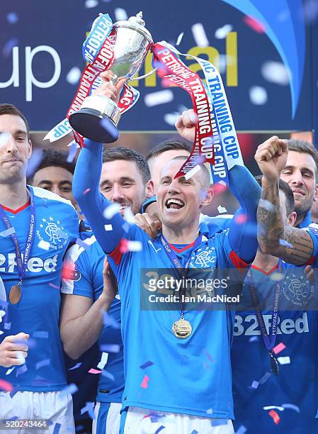 Kenny Miller of Rangers holds the trophy during the Petrofac Training Cup Final between Rangers and Peterhead at Hampden Park on April 10, 2016 in...