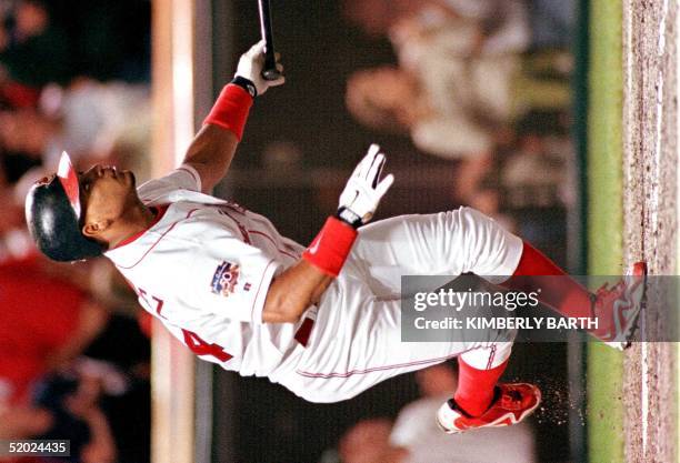 Cleveland Indians right fielder Manny Ramirez watches the ball bounce off the center wall to give him a two-RBI double in the third inning of game...