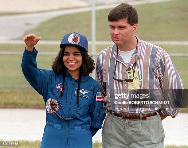 Indian-American astronaut Kalpana Chawla waves to well wishers and family members during a photo opportunity in the perimeter of launch pad 39-B at...