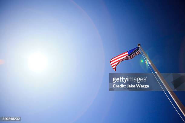 american flag in the sun, arizona - jake warga stock pictures, royalty-free photos & images