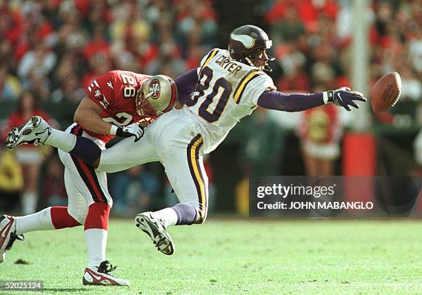 San Francisco 49ers cornerback Rod Woodson breaks up a pass intended for Minnesota Vikings wide receiver Chris Carter in the second quarter of their...