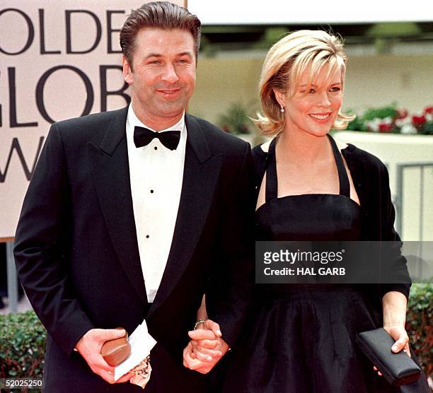 Actress Kim Basinger arrives with her husband actor Alec Baldwin for the 55th Annual Golden Globe Awards at the Beverly Hilton 18 January in Beverly...