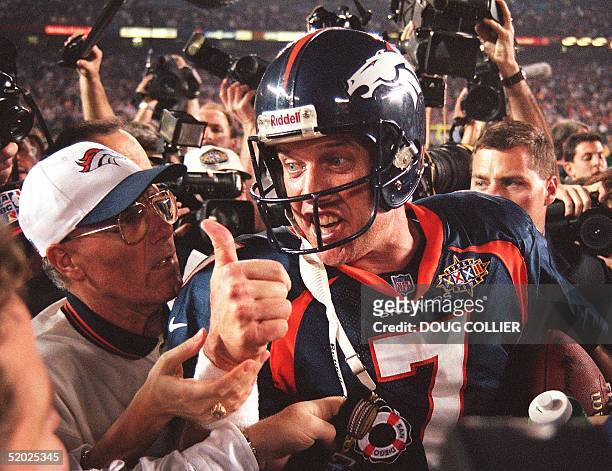 Quarterback John Elway of the Denver Broncos gives the thumbs up after the Broncos defeated the Green Bay Packers 31-24 to win Super Bowl XXXII on...
