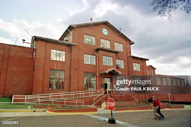 Employees enter the Huntsville Unit in Huntsville, Texas 29 January, the prison that houses the chamber where inmates are put to death in Texas and...
