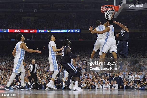 Isaiah Hicks of the North Carolina Tar Heels blocks a shot by Josh Hart of the Villanova Wildcats during the 2016 NCAA Men's Final Four Championship...