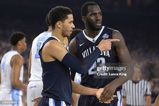 Josh Hart and Daniel Ochefu of the Villanova Wildcats react against the North Carolina Tar Heels during the 2016 NCAA Men's Final Four Championship...