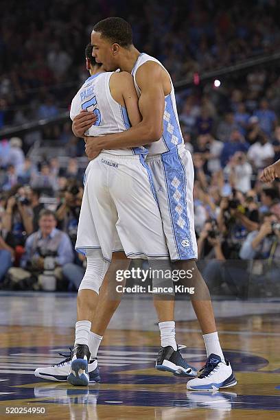 Marcus Paige celebrates following his late-game three-pointer to tie the game with Brice Johnson of the North Carolina Tar Heels during their game...