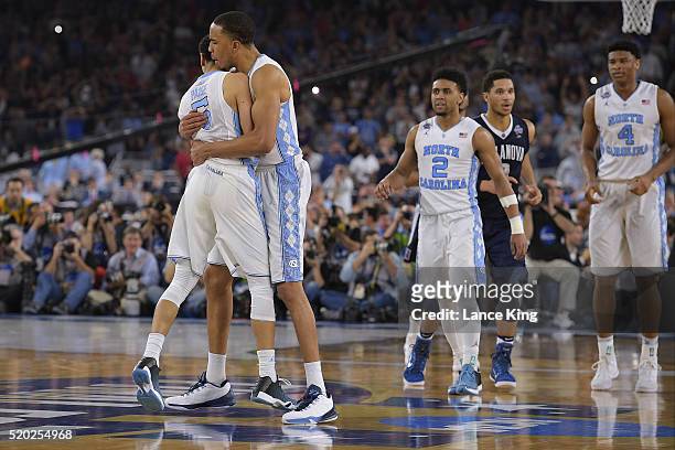 Marcus Paige celebrates following his late-game three-pointer to tie the game with Brice Johnson of the North Carolina Tar Heels during their game...