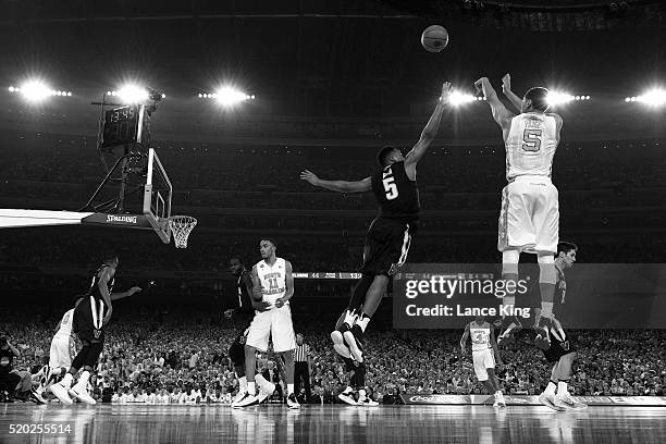 Marcus Paige of the North Carolina Tar Heels puts up a shot against Phil Booth of the Villanova Wildcats during the 2016 NCAA Men's Final Four...
