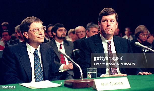 Microsoft chairman Bill Gates sits next to industry competitor Sun Microsystems chairman Scott McNealy before testifying before the US Senate...