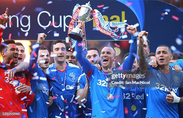 Kenny Miller of Rangers holds the trophy during the Petrofac Training Cup Final between Rangers and Peterhead at Hampden Park on April 10, 2016 in...