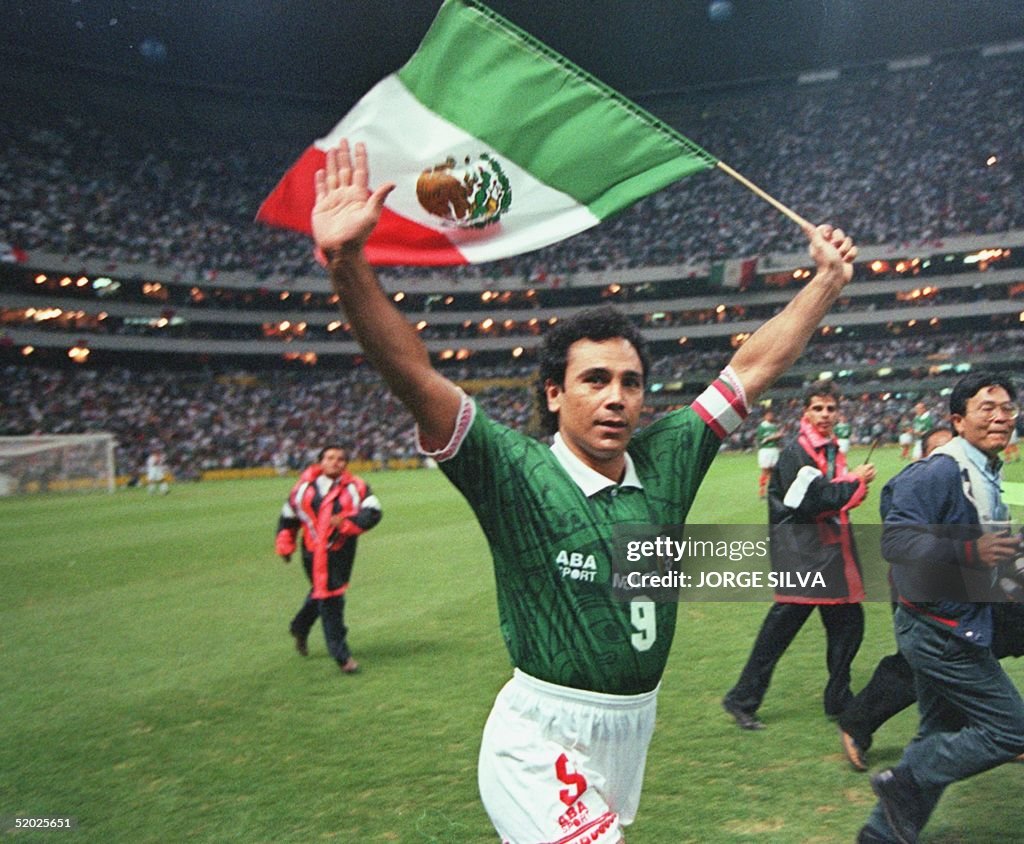 Mexican soccer player Hugo Sanchez waves to fans w