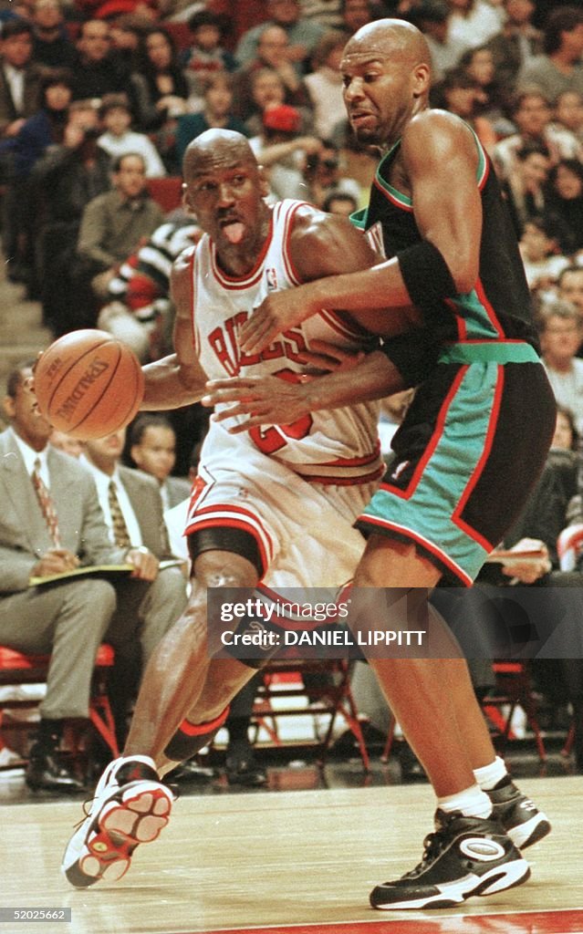 Michael Jordan (L) of the Chicago Bulls takes the